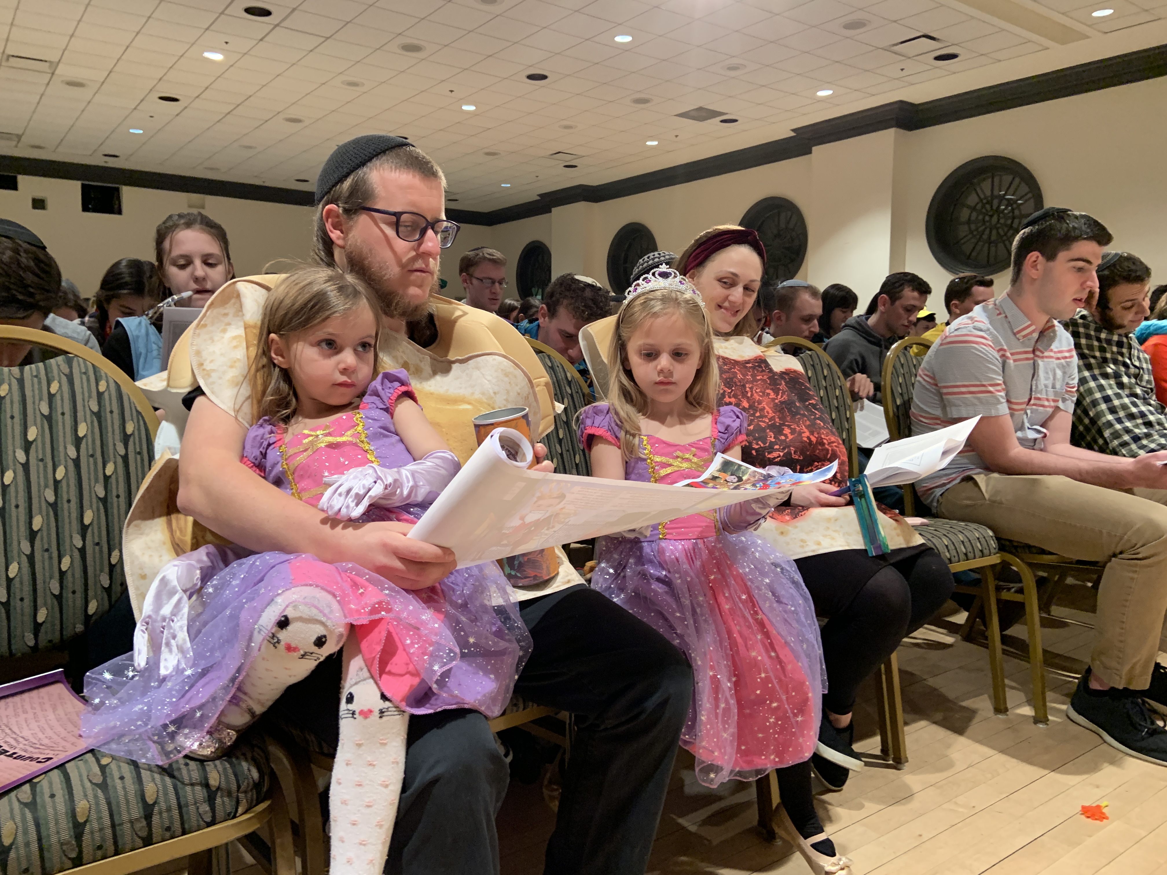 Purim celebrations undimmed despite growing COVID-19 concerns